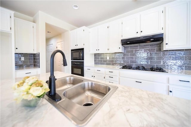 32706 Blue Mist Way, Wildomar, CA 92595 - kitchen featuring tasteful backsplash, a sink, black appliances, white cabinetry, and under cabinet range hood