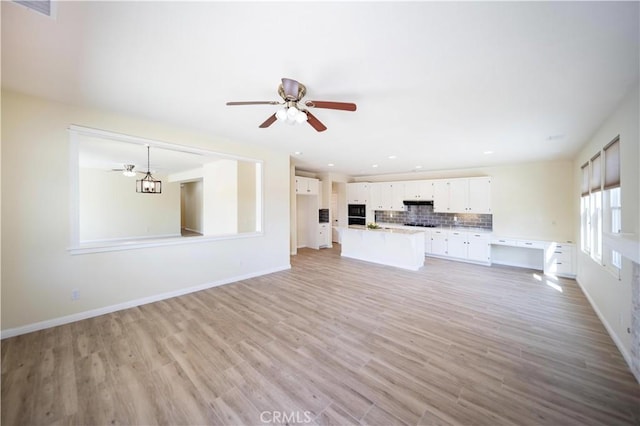 32706 Blue Mist Way, Wildomar, CA 92595 - unfurnished living room featuring light wood finished floors, baseboards, and ceiling fan