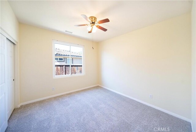32706 Blue Mist Way, Wildomar, CA 92595 - unfurnished bedroom with baseboards, visible vents, light colored carpet, a closet, and ceiling fan