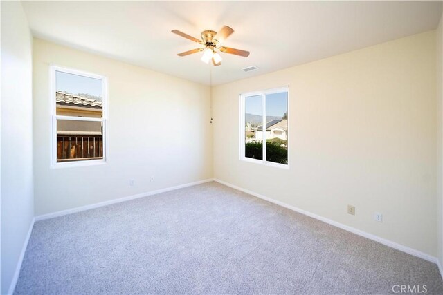 32706 Blue Mist Way, Wildomar, CA 92595 - spare room featuring visible vents, carpet flooring, baseboards, and a ceiling fan