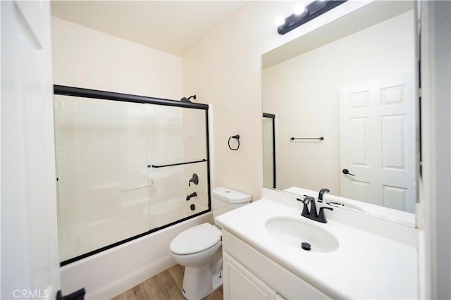 32706 Blue Mist Way, Wildomar, CA 92595 - full bathroom with combined bath / shower with glass door, wood finished floors, vanity, and toilet