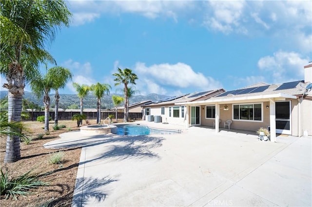 32706 Blue Mist Way, Wildomar, CA 92595 - view of pool featuring a pool with connected hot tub, a fenced backyard, a patio, and central AC unit