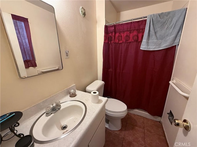 105 Orange Ave, Chowchilla, CA 93610 - bathroom with tile patterned floors, vanity, toilet, and curtained shower