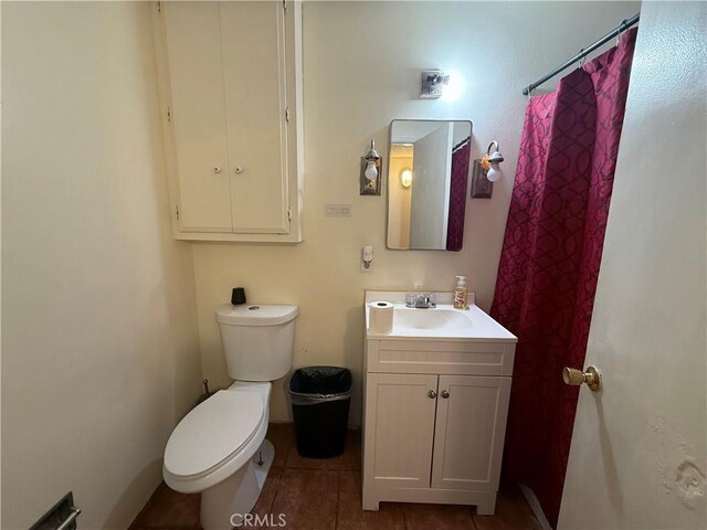 105 Orange Ave, Chowchilla, CA 93610 - full bath with tile patterned floors, toilet, and vanity