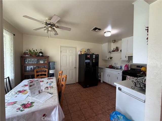 105 Orange Ave, Chowchilla, CA 93610 - kitchen with open shelves, a sink, visible vents, stainless steel range with gas stovetop, and black refrigerator with ice dispenser