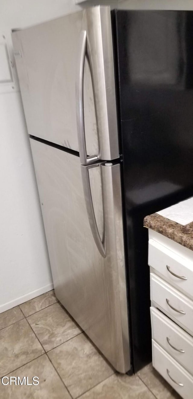 2587 Rudder Ave, Port Hueneme, CA 93041 - interior details featuring baseboards, freestanding refrigerator, and white cabinetry