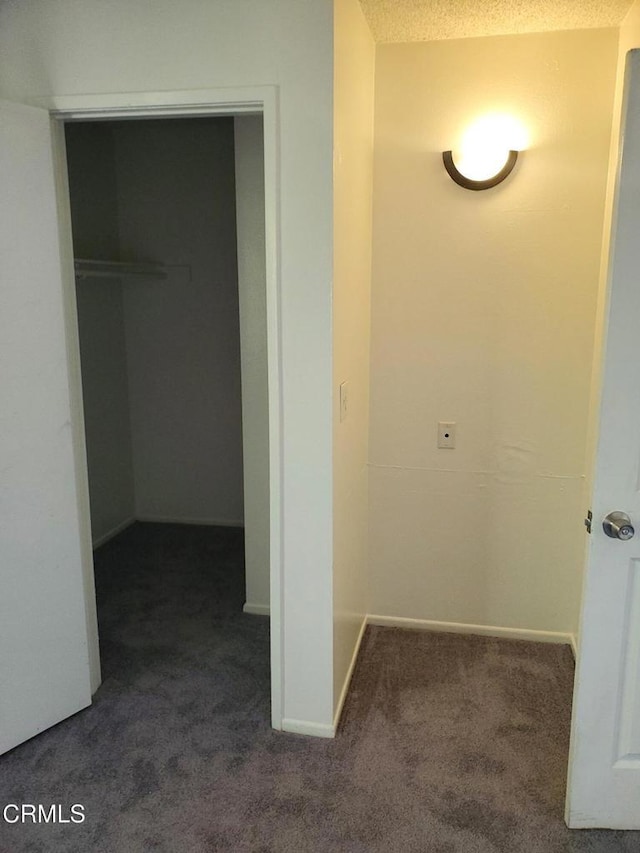 2587 Rudder Ave, Port Hueneme, CA 93041 - interior space with baseboards, dark carpet, and a textured ceiling