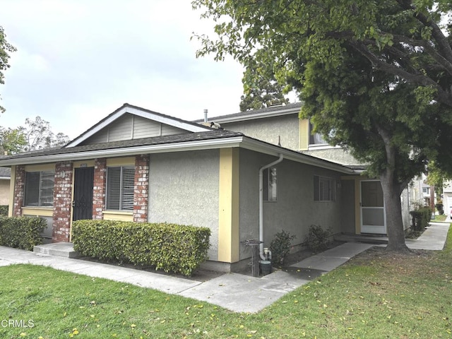 2587 Rudder Ave, Port Hueneme, CA 93041 - view of home's exterior with stucco siding and a yard
