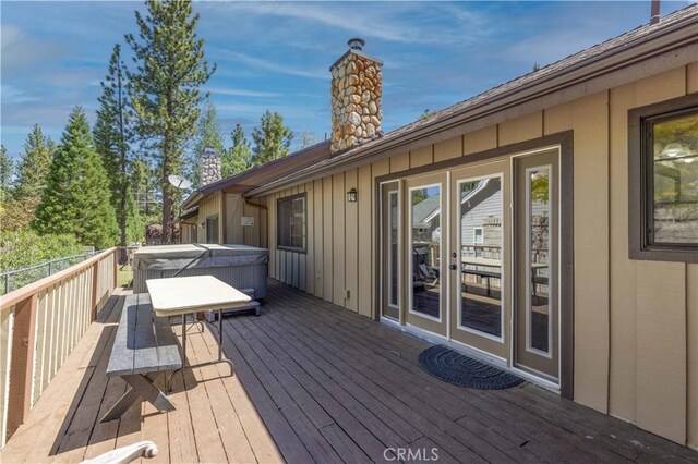 deck with a hot tub