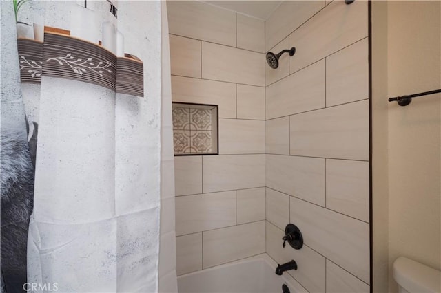 full bathroom featuring toilet and  shower combination