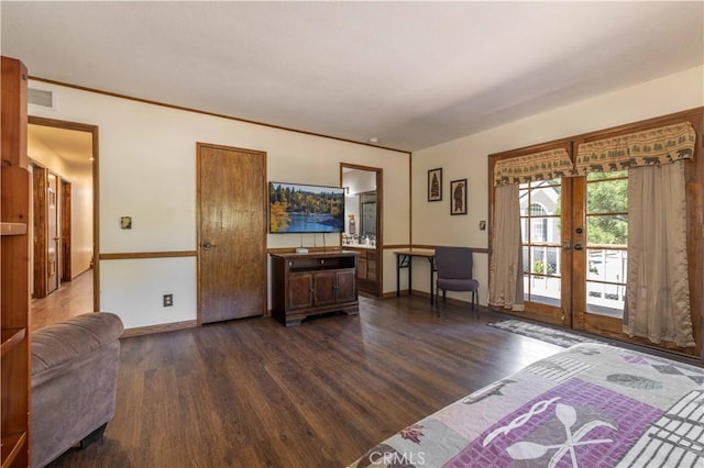 living area featuring baseboards, french doors, dark wood-style floors, and visible vents