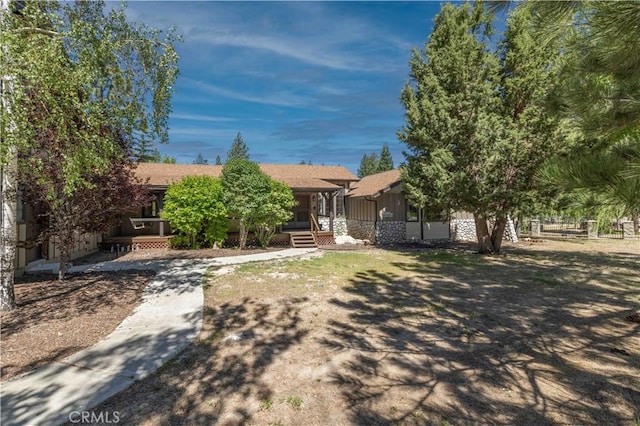 obstructed view of property with a porch