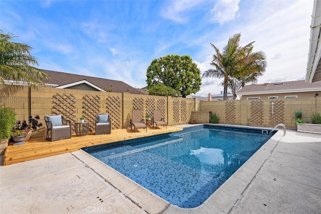 9871 Silver Strand Dr, Huntington Beach, CA 92646 - view of swimming pool with a fenced backyard, a fenced in pool, and a wooden deck