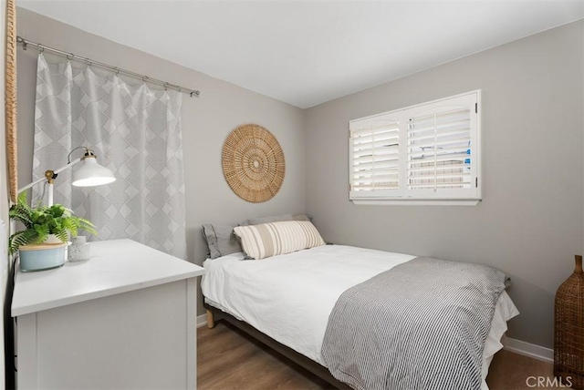 9871 Silver Strand Dr, Huntington Beach, CA 92646 - bedroom featuring baseboards and wood finished floors