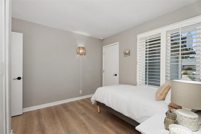 9871 Silver Strand Dr, Huntington Beach, CA 92646 - bedroom with baseboards and wood finished floors