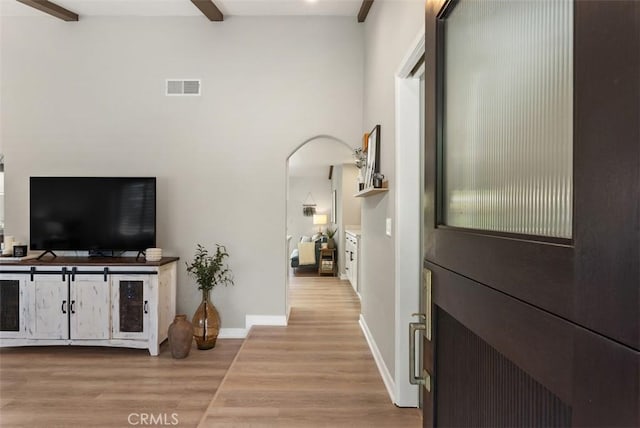 9871 Silver Strand Dr, Huntington Beach, CA 92646 - corridor featuring baseboards, visible vents, beamed ceiling, and wood finished floors