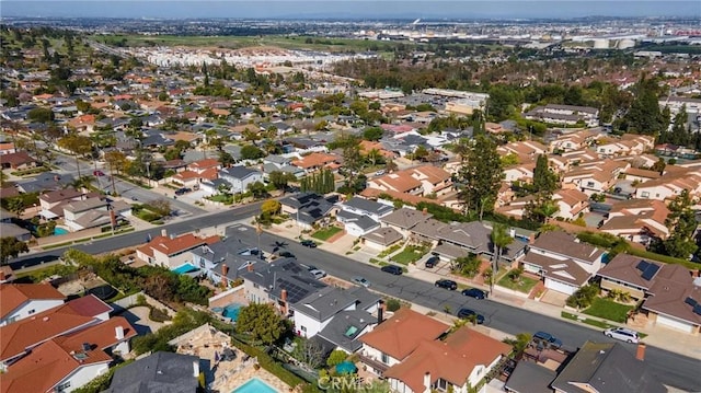 birds eye view of property with a residential view