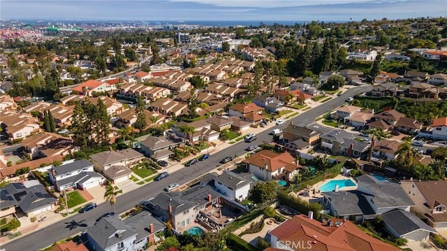 birds eye view of property with a residential view