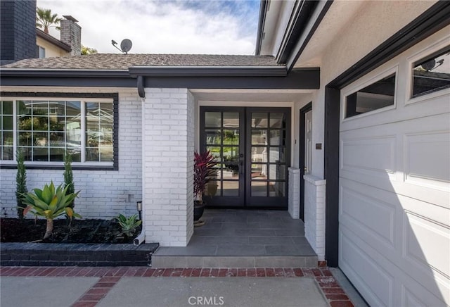 doorway to property with brick siding and french doors