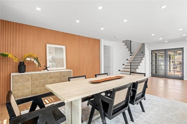 dining area featuring light wood-style floors, stairs, and recessed lighting