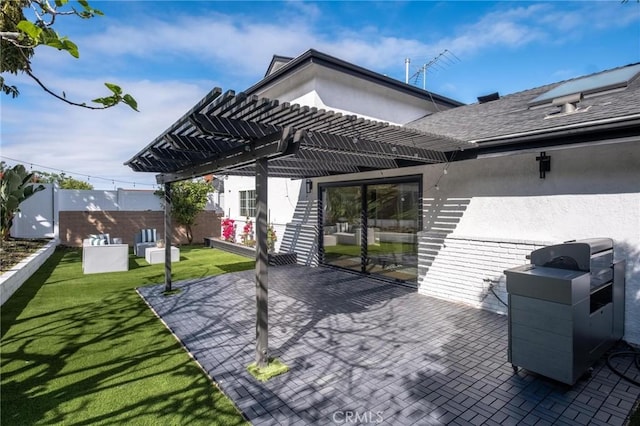 view of patio with fence, grilling area, and a pergola
