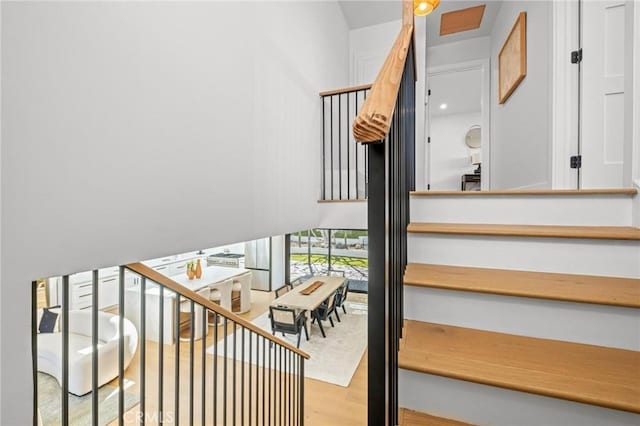 stairway with wood finished floors