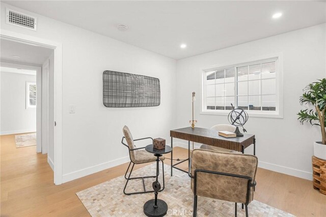 office area with recessed lighting, baseboards, light wood-style floors, and visible vents