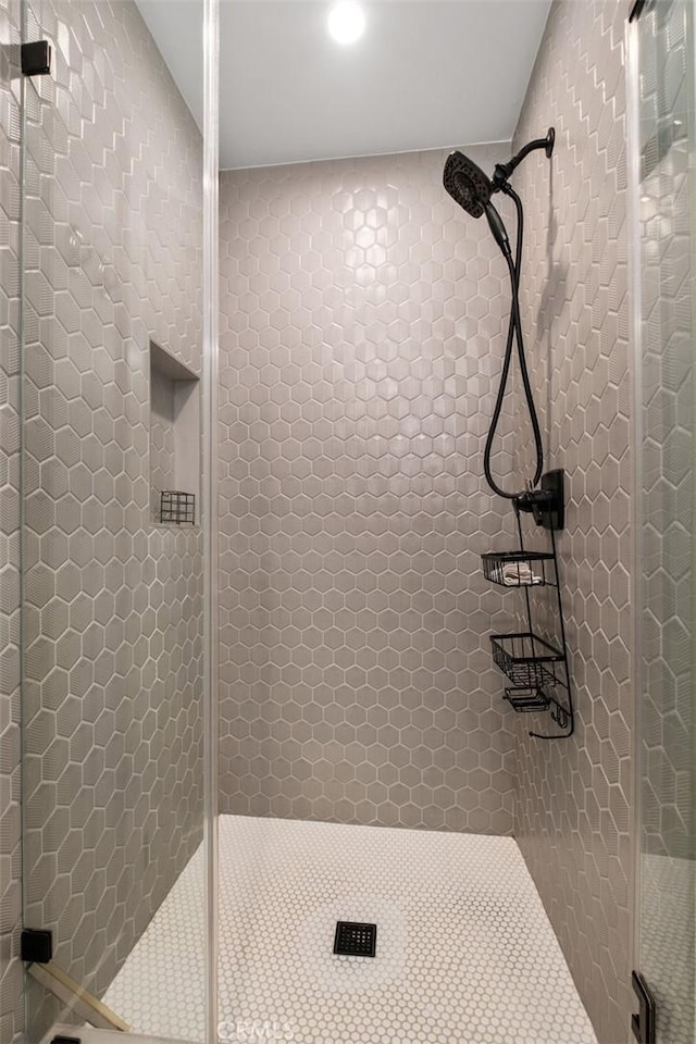 bathroom with a shower stall