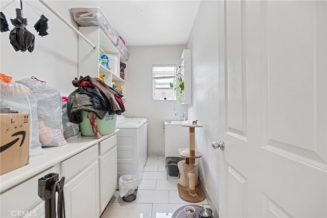 25445 Clovelly Ct, Moreno Valley, CA 92553 - laundry room featuring washing machine and dryer, a sink, cabinet space, and light tile patterned floors
