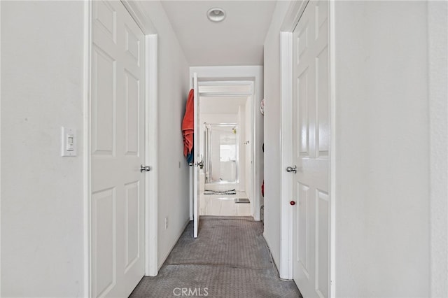 25445 Clovelly Ct, Moreno Valley, CA 92553 - hallway with dark colored carpet