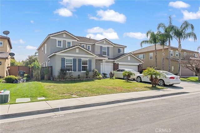 25445 Clovelly Ct, Moreno Valley, CA 92553 - traditional-style house with a front yard, concrete driveway, stucco siding, and fence