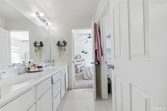 25445 Clovelly Ct, Moreno Valley, CA 92553 - bathroom featuring tile patterned floors, toilet, a sink, a ceiling fan, and double vanity