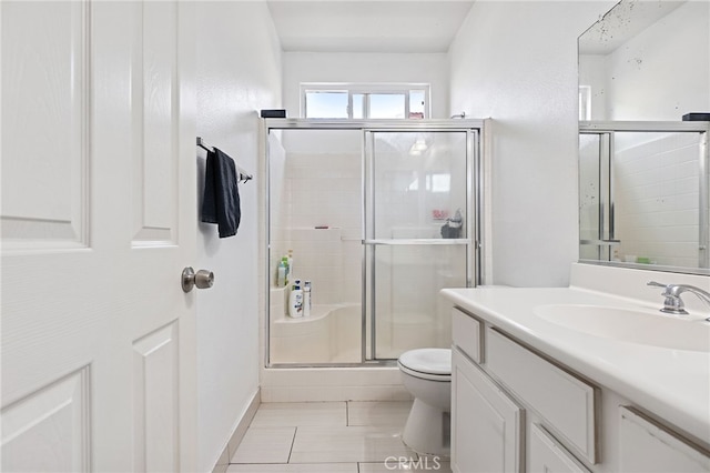 25445 Clovelly Ct, Moreno Valley, CA 92553 - full bathroom featuring toilet, vanity, a stall shower, and tile patterned flooring