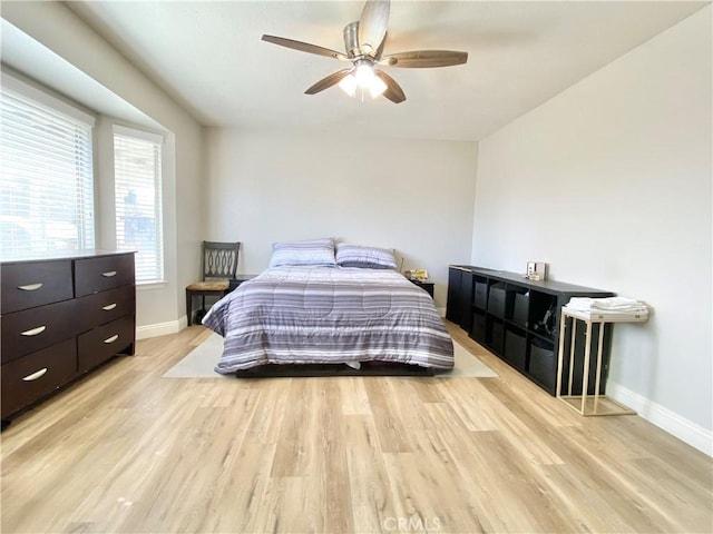 11031 Victor Ave, Hesperia, CA 92345 - bedroom with baseboards, light wood-type flooring, and a ceiling fan