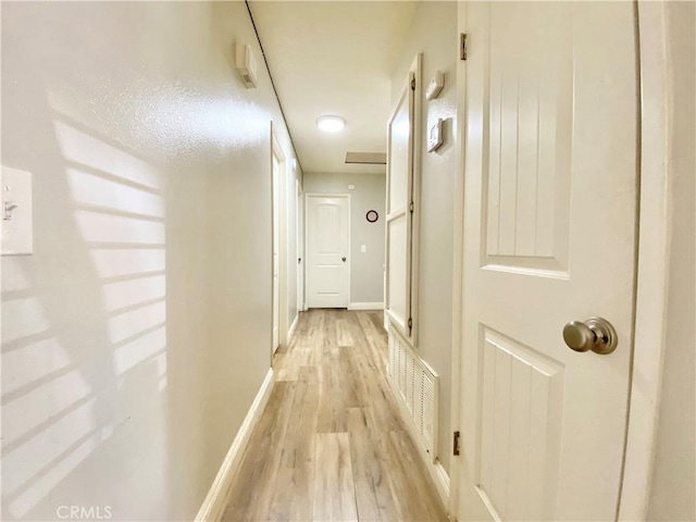 11031 Victor Ave, Hesperia, CA 92345 - hallway featuring light wood-style floors and baseboards