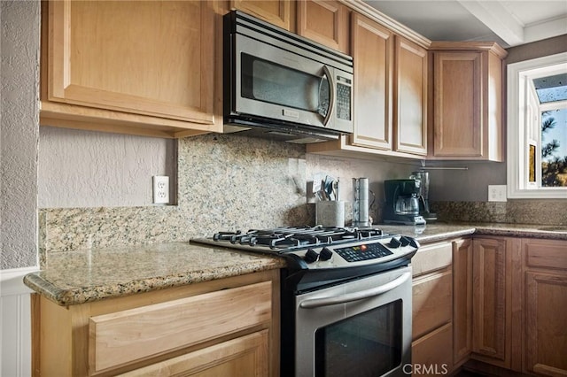 475 Woodsey Rd, Crestline, CA 92325 - kitchen with tasteful backsplash, appliances with stainless steel finishes, light stone counters, and brown cabinets