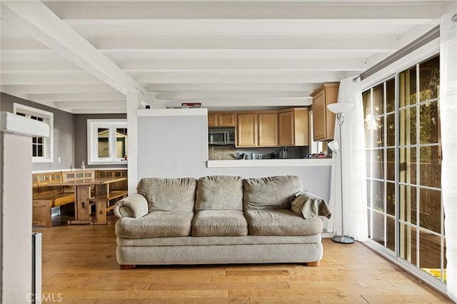 475 Woodsey Rd, Crestline, CA 92325 - living area with light wood-type flooring, beam ceiling, and a healthy amount of sunlight