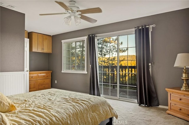 475 Woodsey Rd, Crestline, CA 92325 - carpeted bedroom featuring access to exterior, visible vents, and a ceiling fan