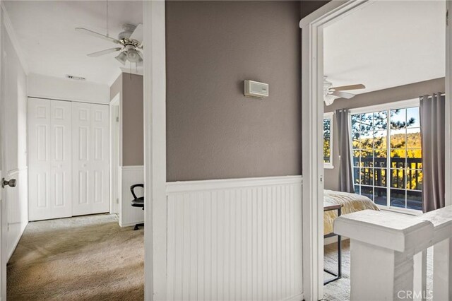 475 Woodsey Rd, Crestline, CA 92325 - corridor featuring carpet flooring, visible vents, and wainscoting