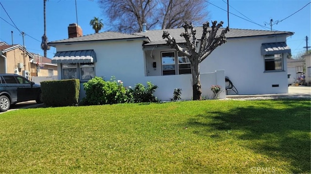 1640 Alameda St, Pomona, CA 91768 - view of home's exterior featuring a yard and stucco siding