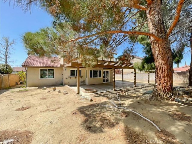 43856 Windsor Pl, Lancaster, CA 93536 - back of property featuring a patio, stucco siding, and a tile roof