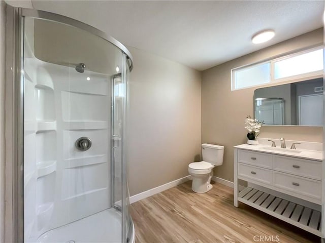 43856 Windsor Pl, Lancaster, CA 93536 - bathroom featuring a shower stall, vanity, and wood finished floors
