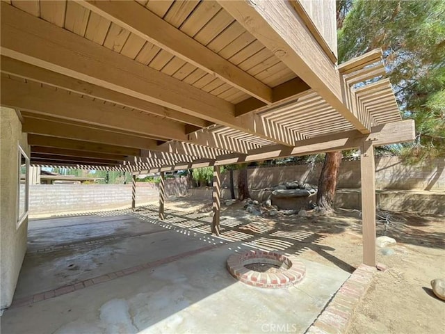 view of patio with fence and a pergola