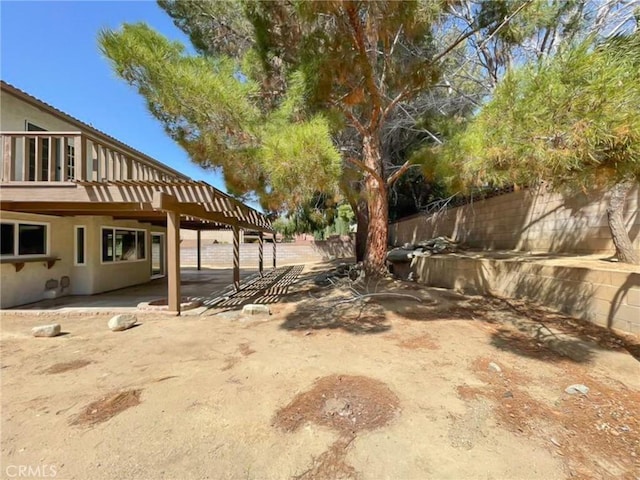 view of yard featuring a patio and fence