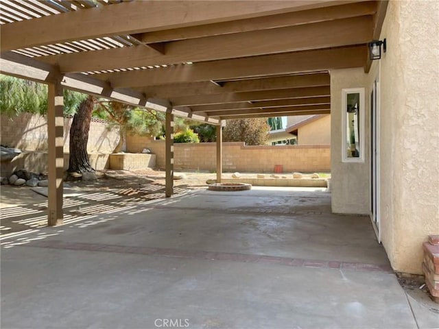 view of patio / terrace with a fenced backyard and a pergola