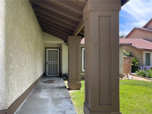 property entrance featuring stucco siding