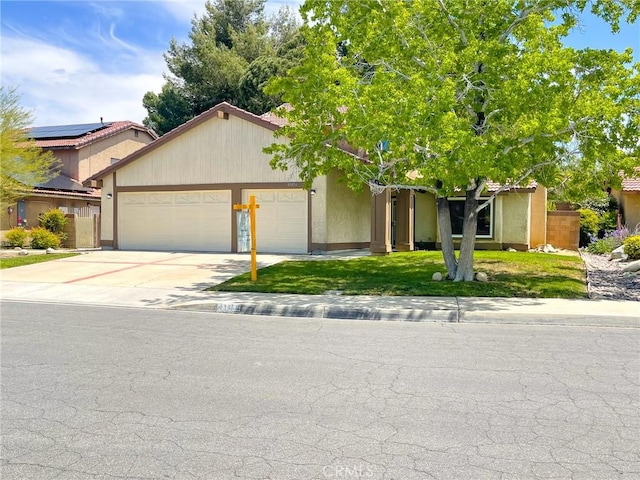 43856 Windsor Pl, Lancaster, CA 93536 - ranch-style home with a garage, driveway, and stucco siding