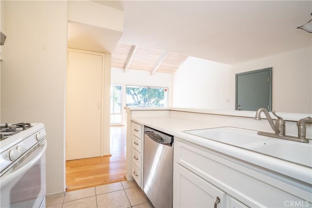 kitchen featuring light countertops, stainless steel dishwasher, a sink, light tile patterned flooring, and white range with gas cooktop