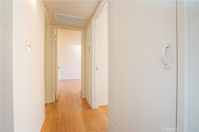 hall featuring visible vents and light wood-type flooring