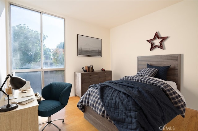 bedroom featuring wood finished floors
